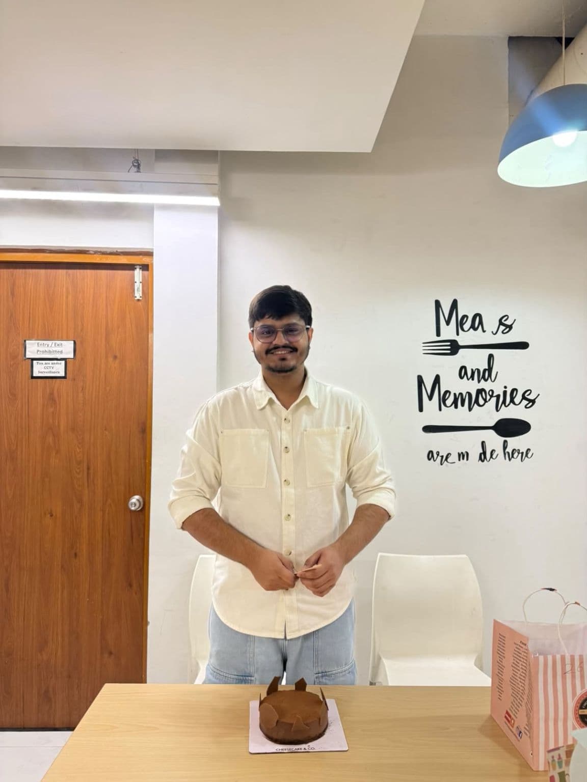 Adesh Singh with a farewell cake at the BigOhTech office